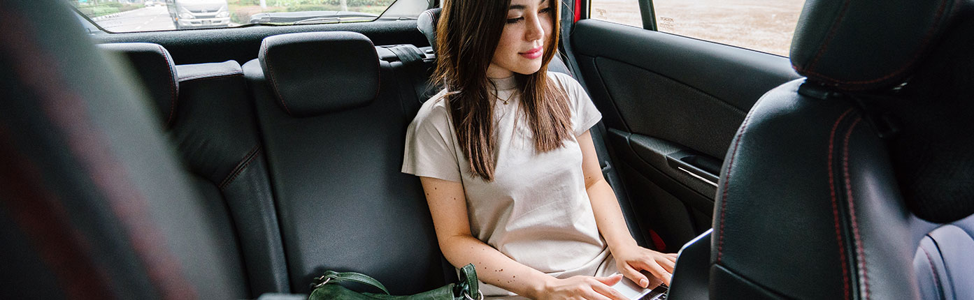 Woman Working in the back of a Car 1